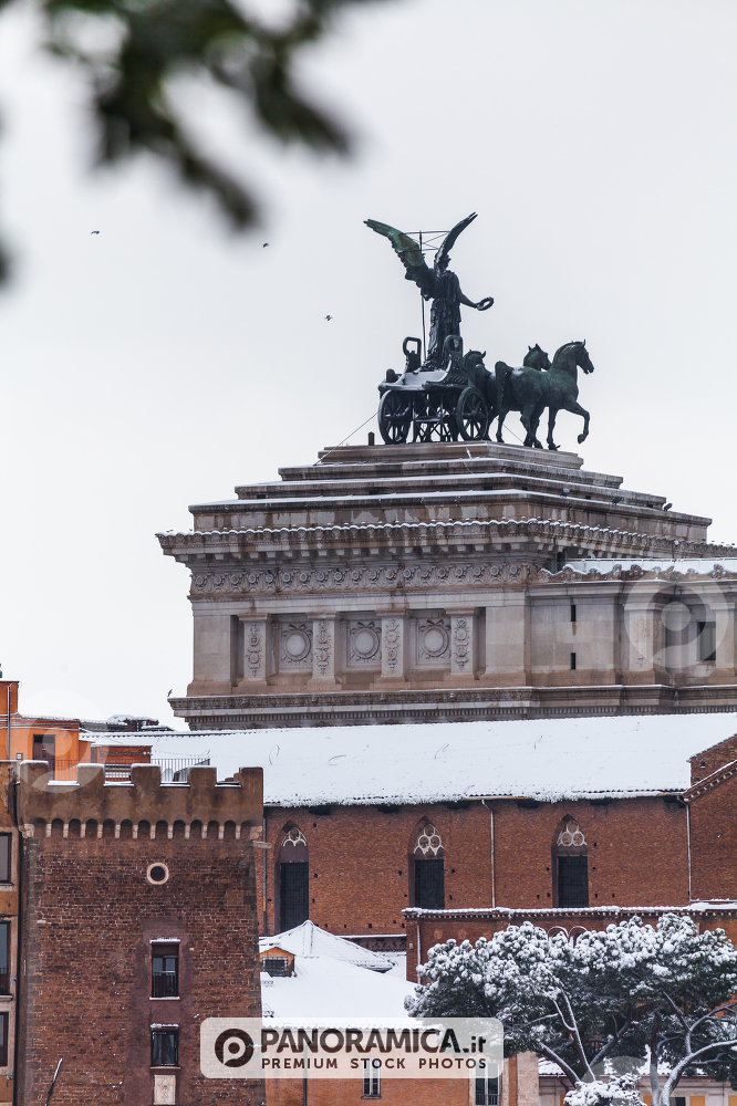 A lovely day of snow in Rome, Italy, 26th February 2018: a beautiful view of Altare della Patria near the Colosseum under the snow
