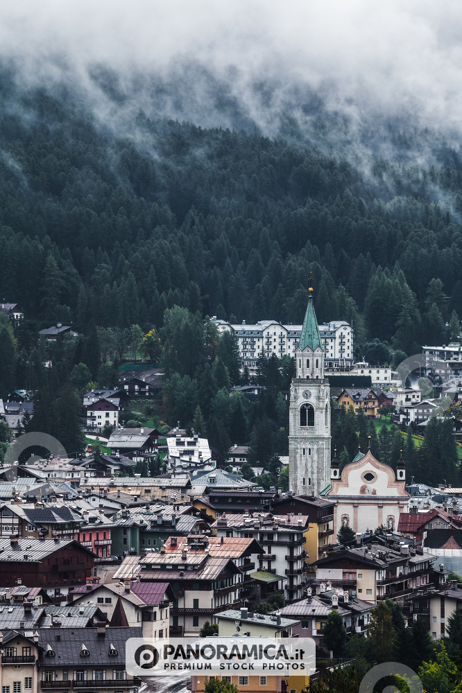 A view of the bell tower of Cortina d'Ampezzo from an high valley, Veneto, Dolomites, Italy