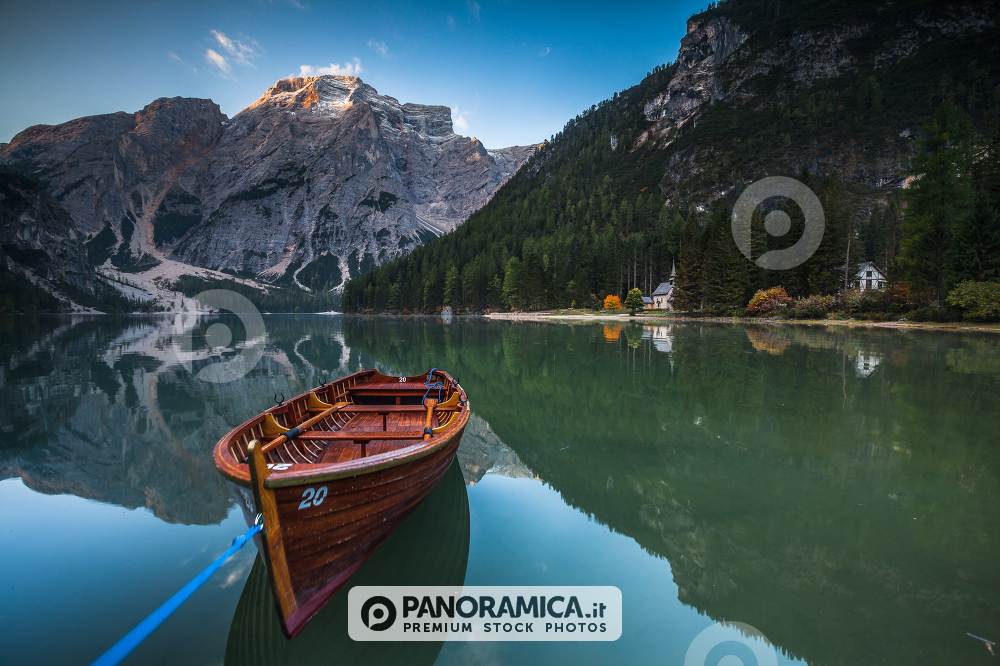 Boat floating on Lago di Braies, Pragser Wildsee, Dolomites, South Tyrol, Italy