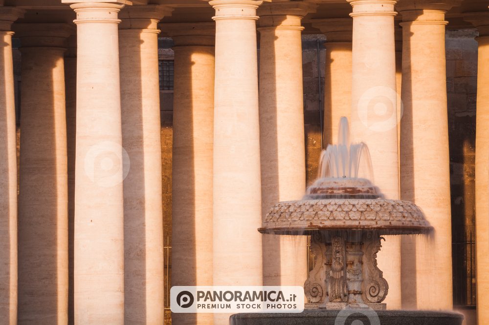 The Bernini's Fountain in front of the Column in Saint Peter Square, near the Basilica of Saint Peter in Rome, Italy