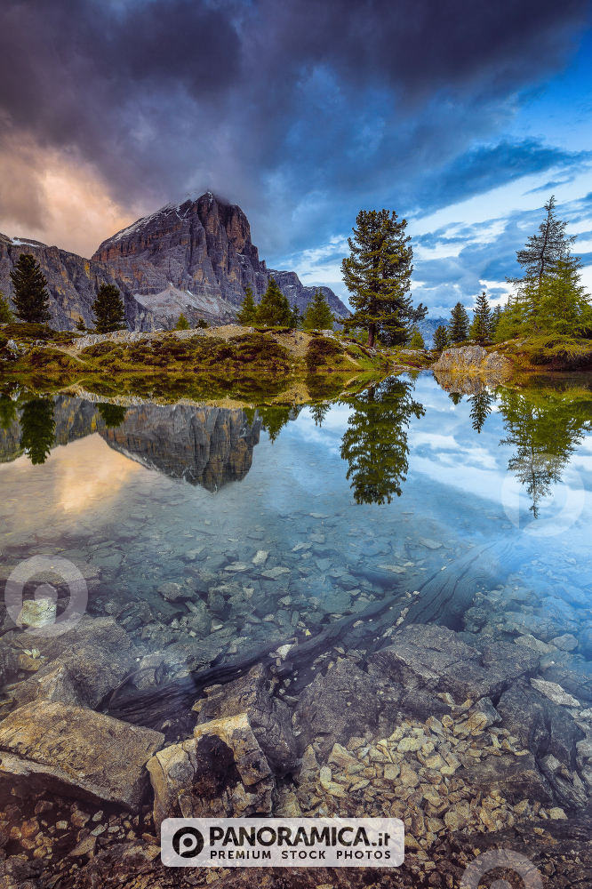 Tofana di Rozes reflected in the alpine Lake Limedes, Falzarego Pass, Dolomites, Veneto, Italy